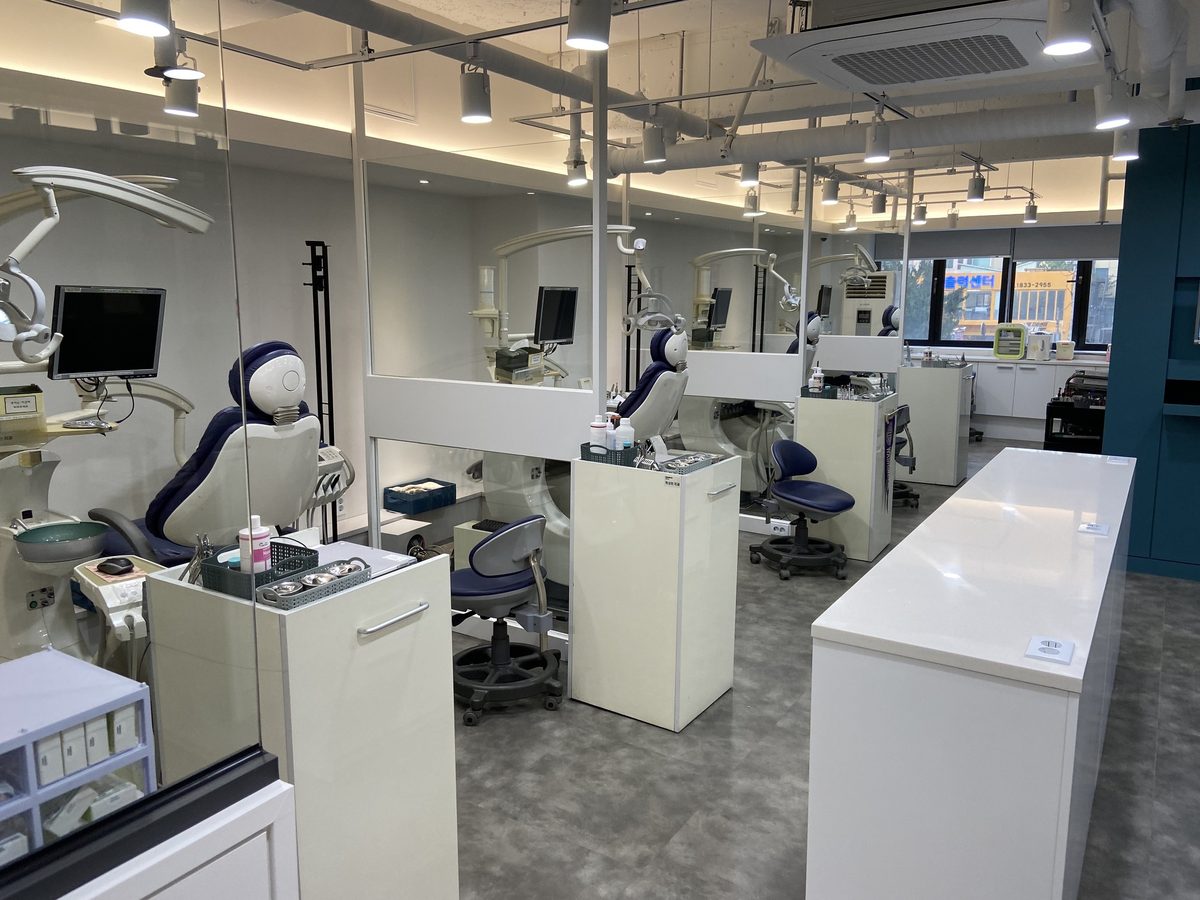 Treatment room with partitioned dental units at Washington Dental Orthodontic Clinic